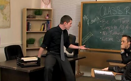 A teacher puts his twink student up on his desk and blows him.