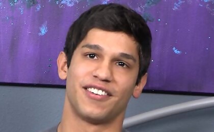 Carmine posing naked in a bedroom