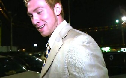 Guy in a suit sucking off dick