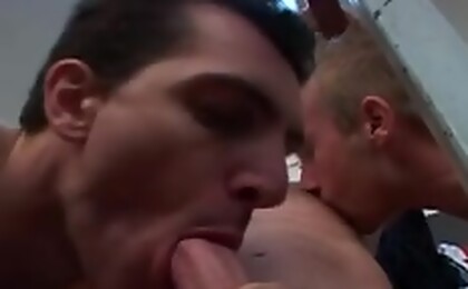 Athletic rugby players have a threesome after a long game.