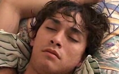 Cute college boy gets undressed while sleeping.