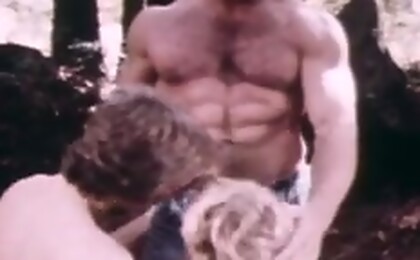 Rugged man fucks two teen boys outside their tent in woods.