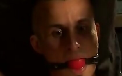 Stripped down naked rock star Wayneâ€™s sensitive cock and balls are completely vulnerable to punishment of the twisted men at BreederFuckers