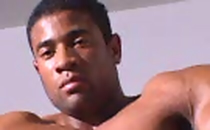 Brazilian bodybuilder Robert Bueno posing naked ina gym