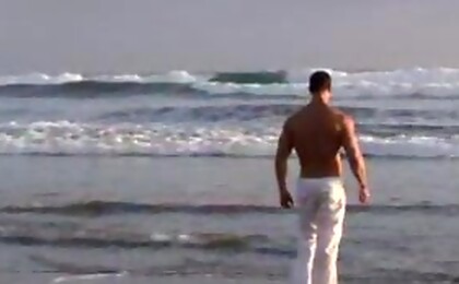 Vic Rocco naked on a beach