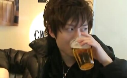 Asian twink drinking a beer