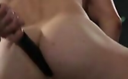 Muscled man plays with his ass