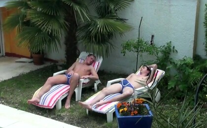 Boys sunbathing together