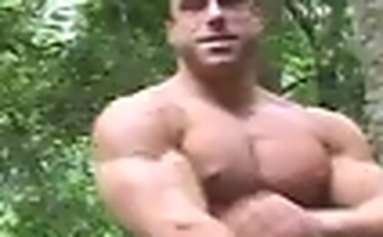 Bodybuilder posing outdoors. MH men.