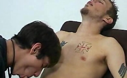 Cute tattooed boy gets his cock sucked and jerked off.