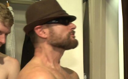 Muscled stud worships feet and takes cock after cock in bondage