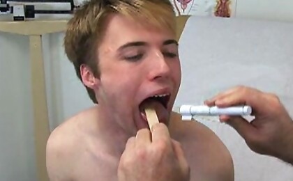 Cute college boy gets jerked off by the doctor.