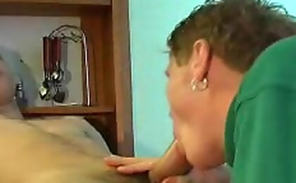 Two young guys are having some blowjob party on the table. 