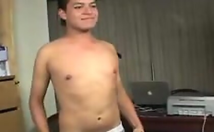 Hot guy sits on chair to stimulate himself as someone watchs