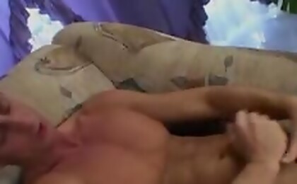 Cute muscular dude wanking on that chair and cum on himself