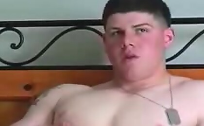 Cute twink in uniform enjoying his cock in solo play