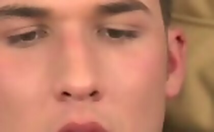 Young kinky guy masturbating on his bed after an interview