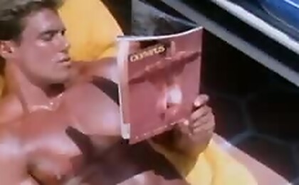 Hot businessman getting his dick hard over a gay magazine