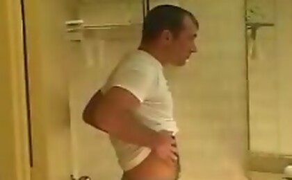 Hairy stud masturbating his meat and cum all over himself