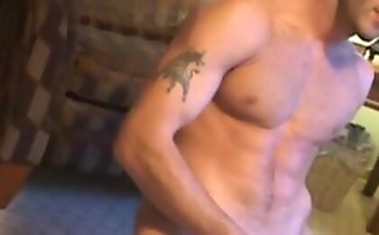 The young stallion slowly undresses and strokes his cock! 
