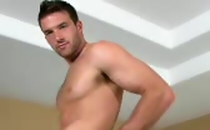 The cute buddy strokes his piece of wood on a pool table! 